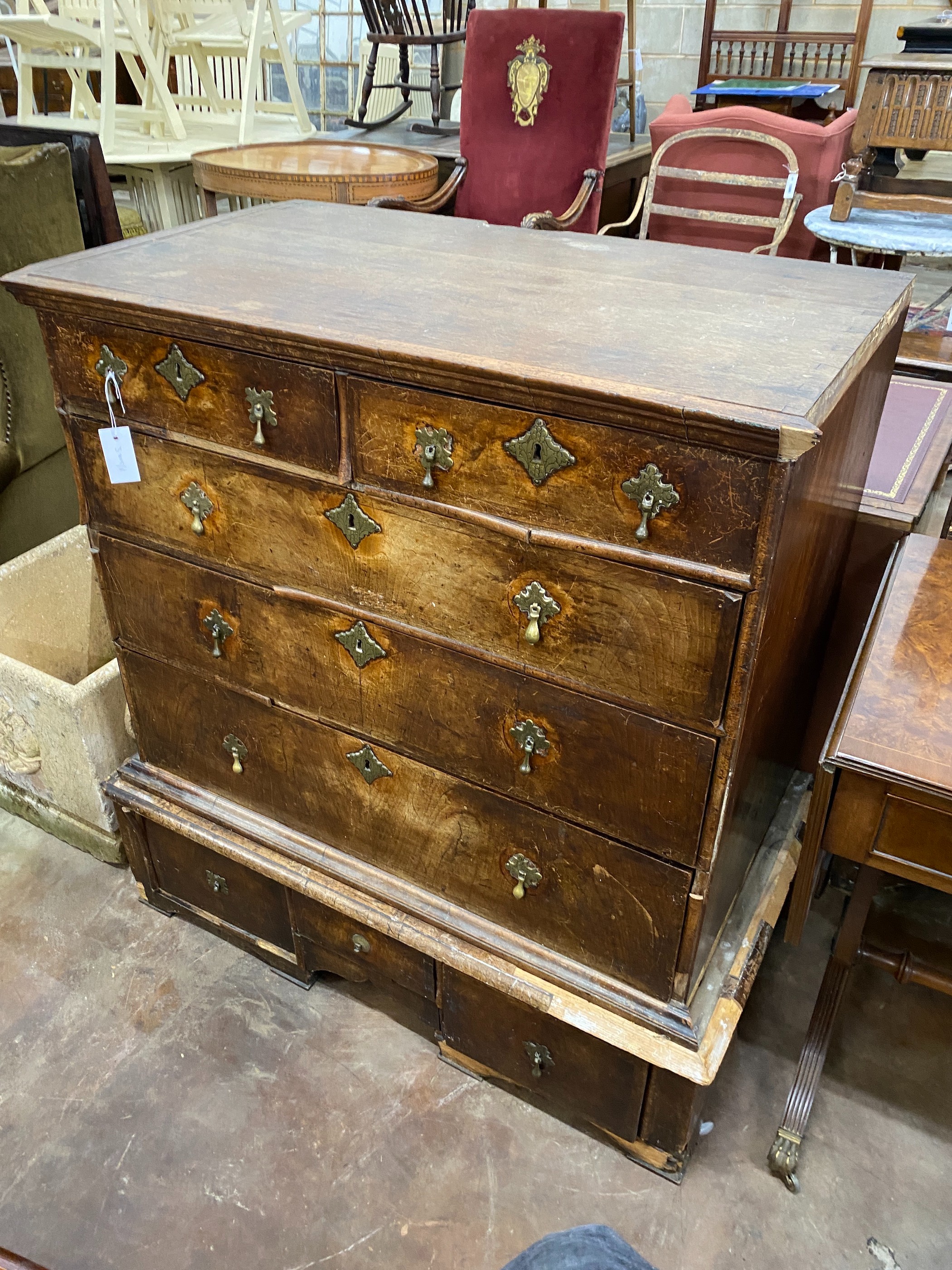 An 18th century walnut chest on stand requiring restoration, width 96cm, depth 55cm, height 108cm